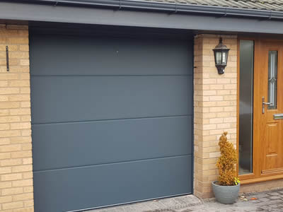 Sectional garage doors